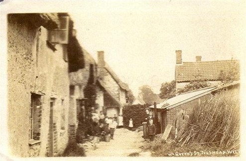 Black and white image of a row of cottages
